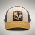 Pearls and Swine trucker hat in birch and gold, front view, patch of pigs in a pen with pearls in the mud