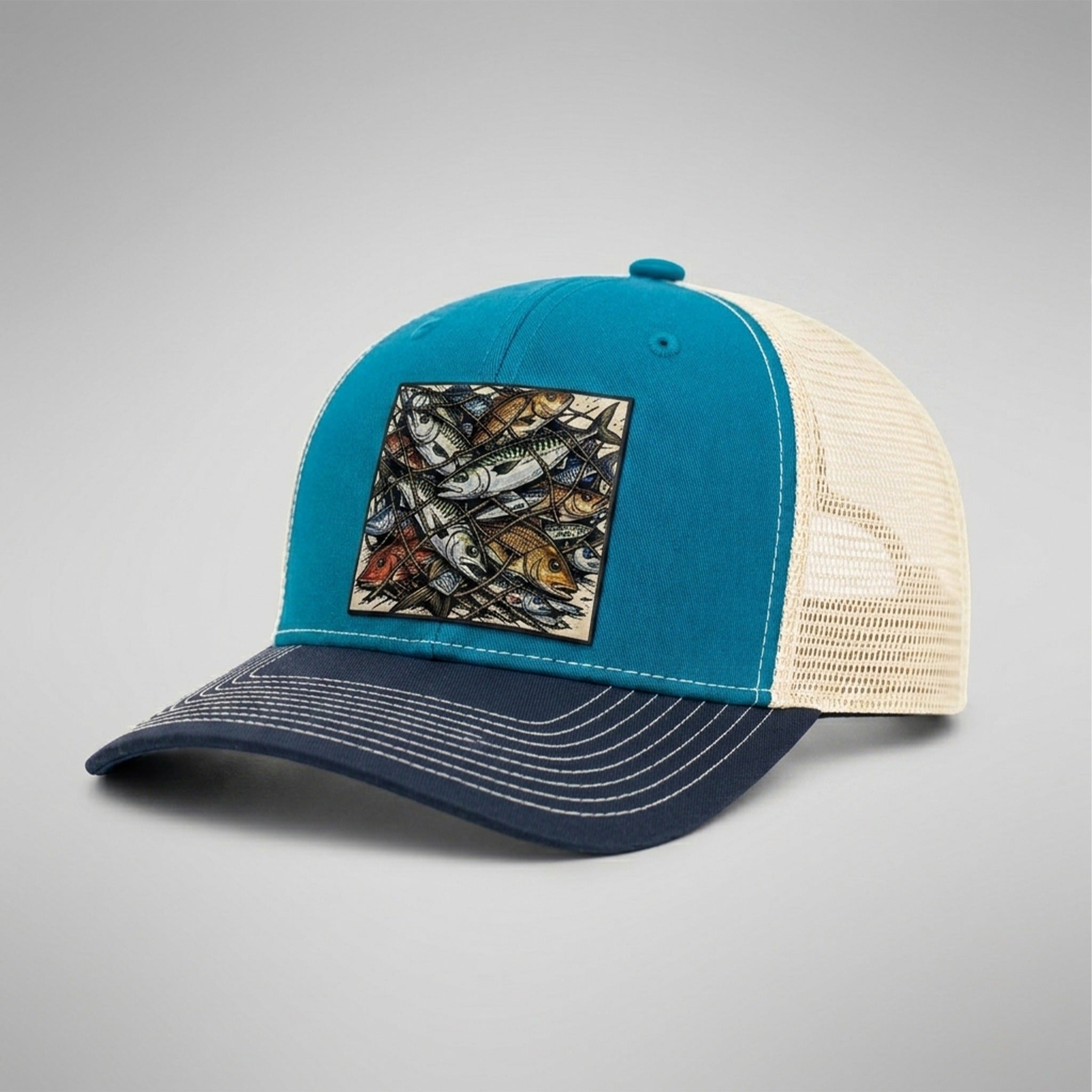 Sorted trucker hat in teal and navy, side view showing the birch mesh back and navy pre-curved bill