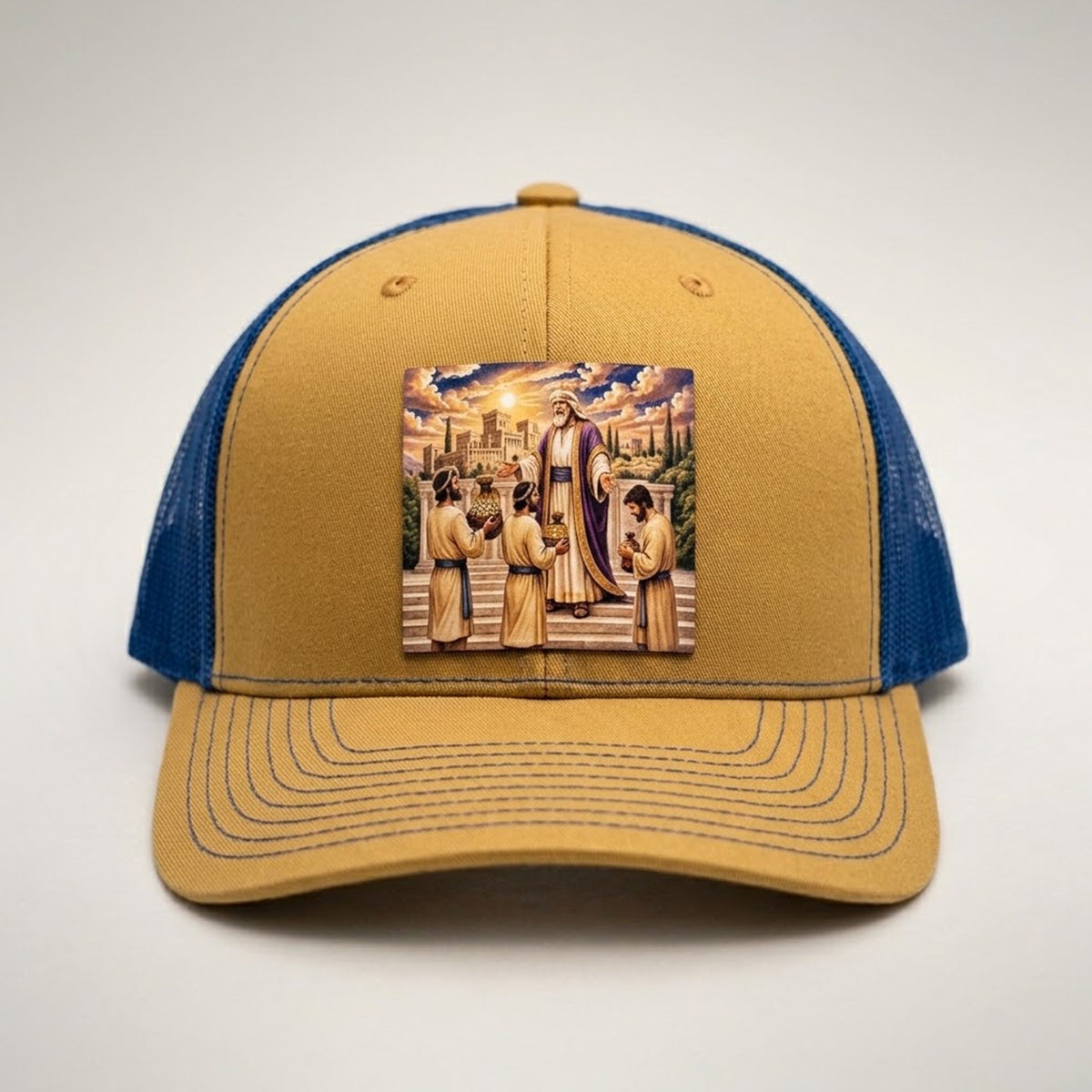 Talents trucker hat in gold and royal blue, front view, patch of a master settling accounts with his servants